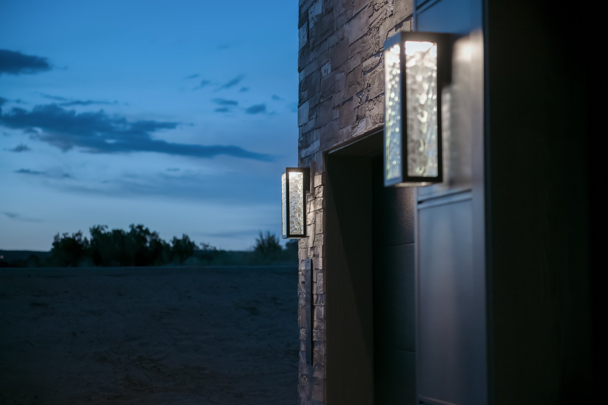 Exterior lights on either side of a garage door